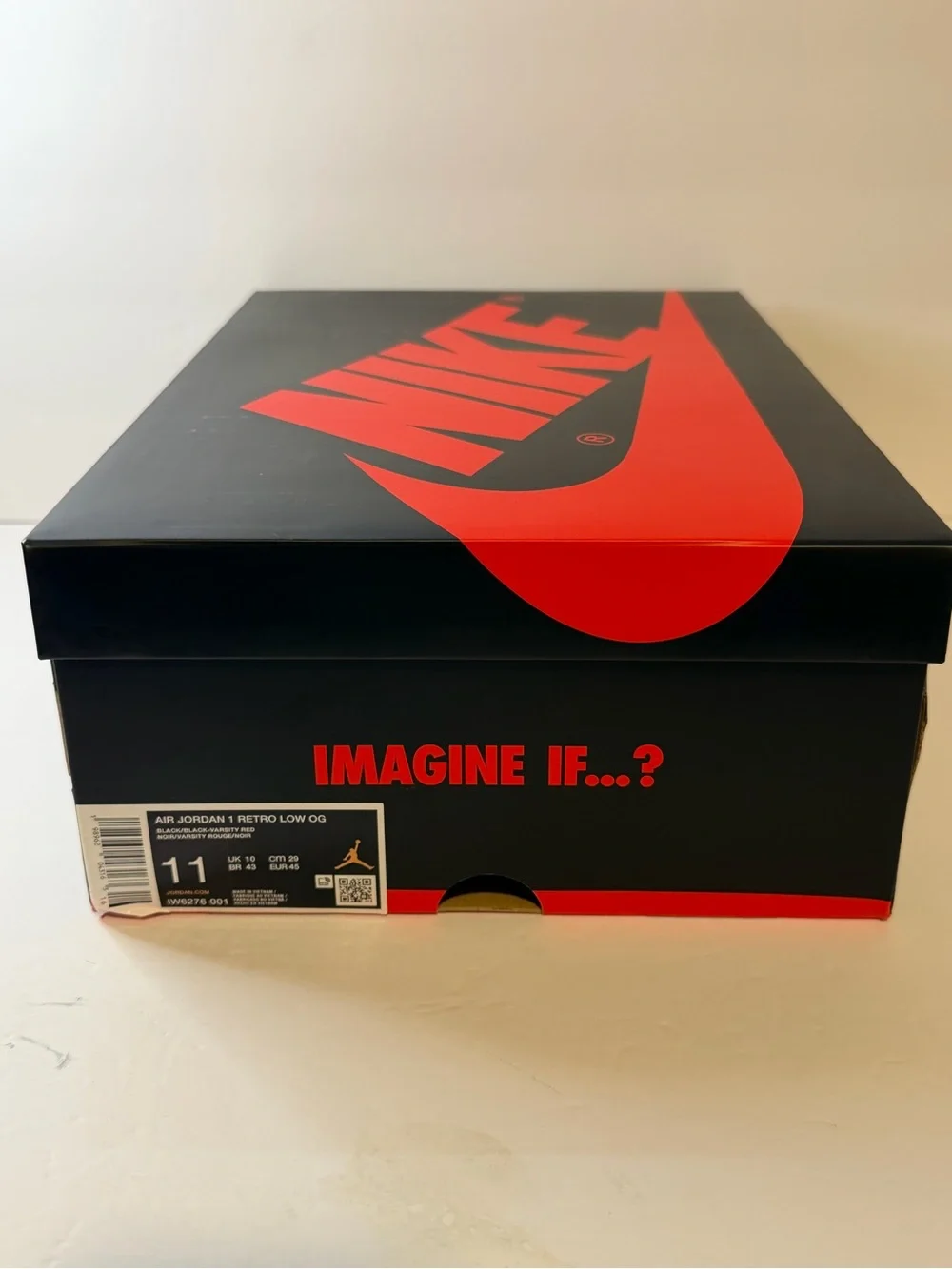Jordan Low Top Sneaker in Black and Red